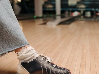 Close up of sports shoes on a dark floor